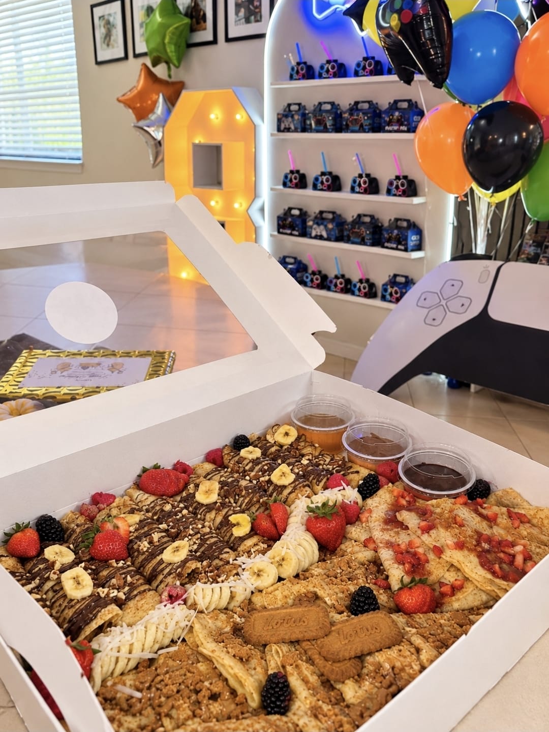 LOCO Crêpes party box with chocolate, fruit, Biscoff crumbs, and dipping sauces at a birthday celebration